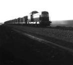 [Loco hauling a contractor's ballast train on the Baghdad - Akashat line]