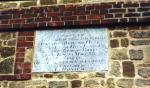 [Plaque on tower wall]